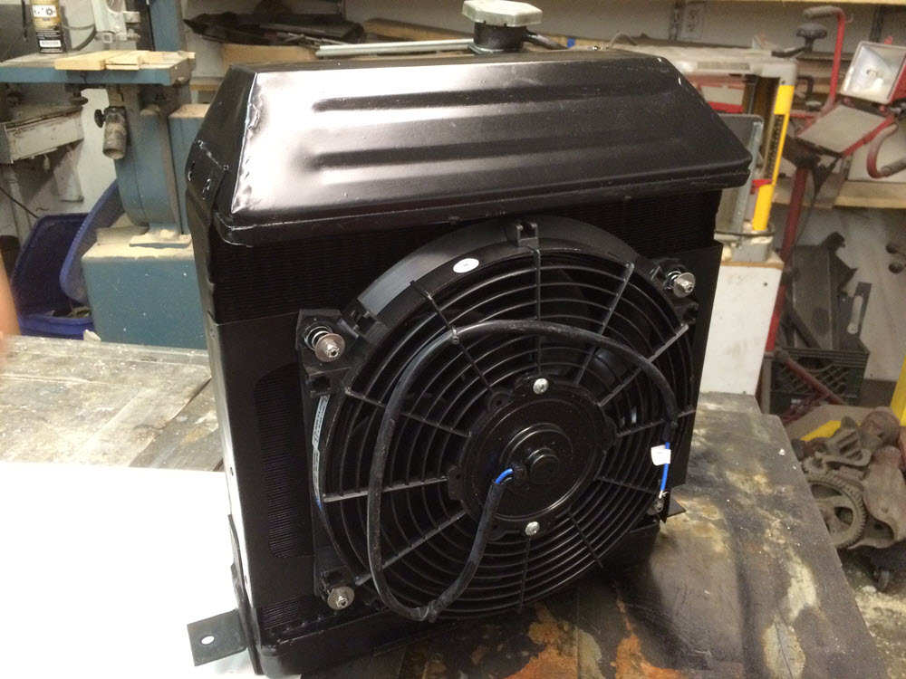 electric fan mounted on stand-off brackets